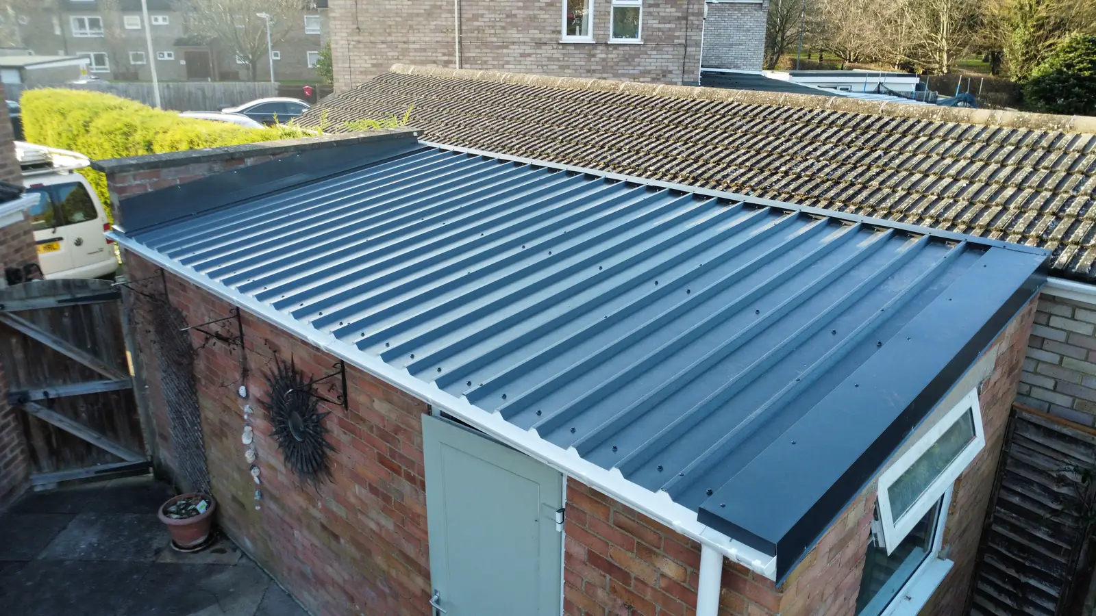 Anthracite box profile metal roof fitted to a domestic garage by Over The Ridge Roofing