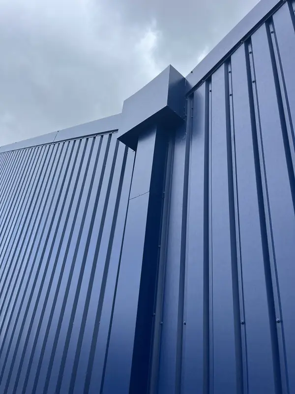Close-up detail of metal roof flashing and standing seam